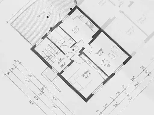 Plan domu z zaznaczonym metrażem pomieszczeń: kuchnia, łazienka, salon, sypialnia i taras. Wymiary podane w m².
